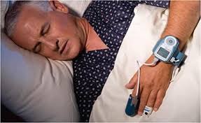man wearing watchpat; can help determine if sleep apnea treatment is needed