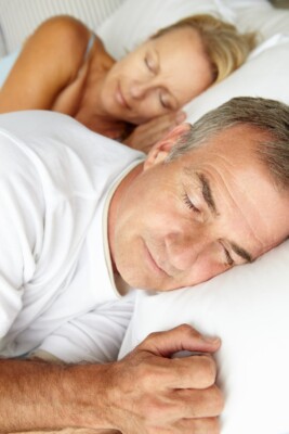 A sleeping couple because of the treatment for sleep apnea they recieved in Burke, Virginia