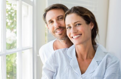 A happy couple that utilizes the holistic dentistry that is offered in Burke, Virginia